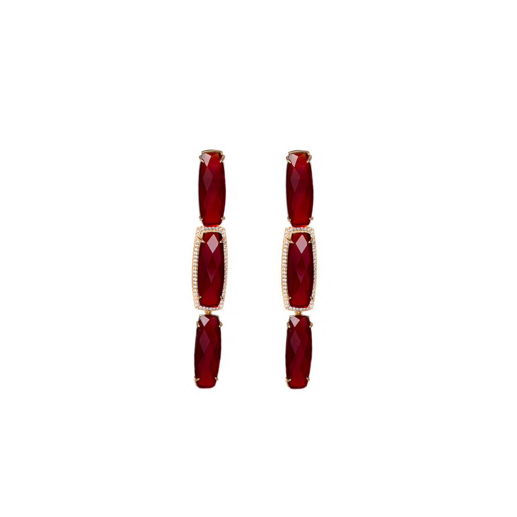 Baguette Shape red crystals in 18k Gold frame. Three inches long.