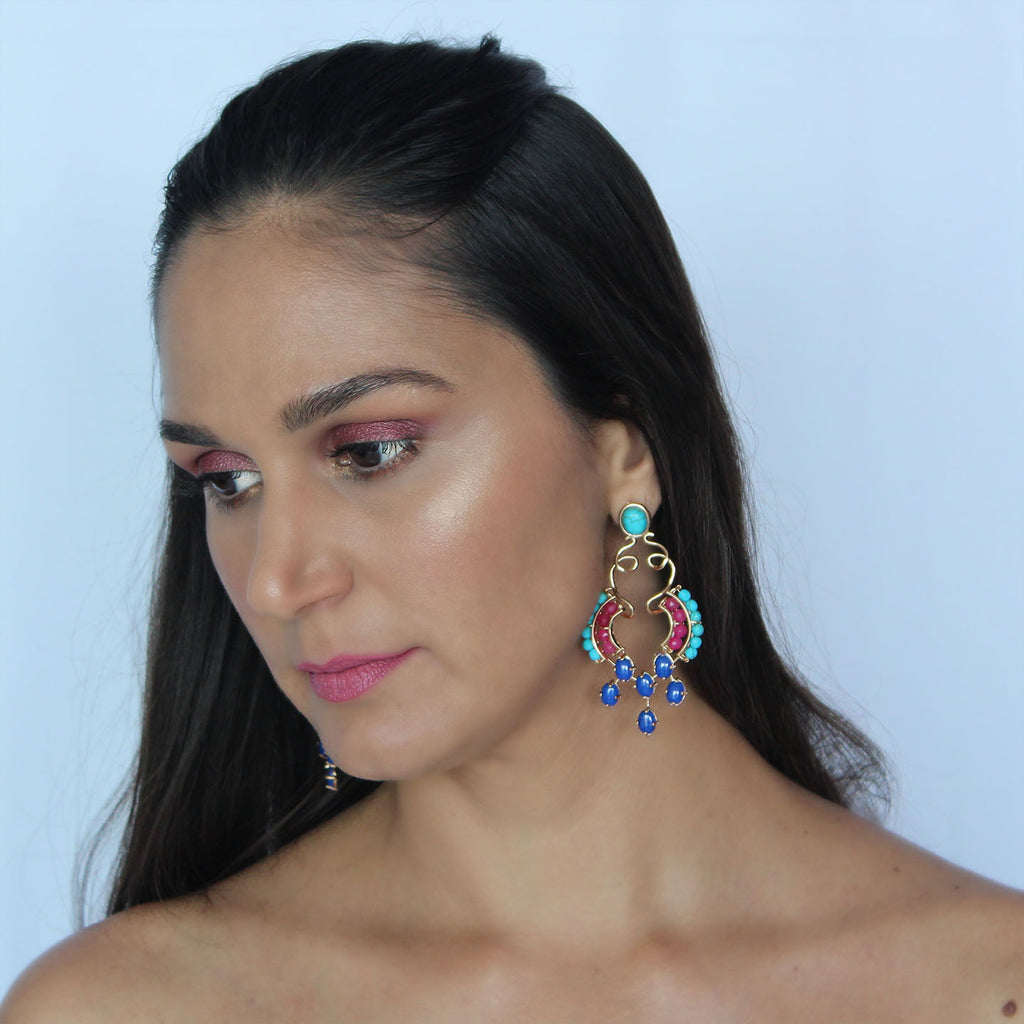 Statement earrings on model